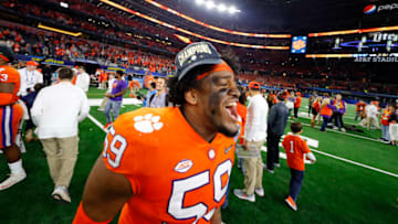 ARLINGTON, TEXAS - DECEMBER 29: Jordan Williams #59 of the Clemson Tigers celebrates after defeating the Notre Dame Fighting Irish during the College Football Playoff Semifinal Goodyear Cotton Bowl Classic at AT&T Stadium on December 29, 2018 in Arlington, Texas. Clemson defeated Notre Dame 30-3. (Photo by Kevin C. Cox/Getty Images)