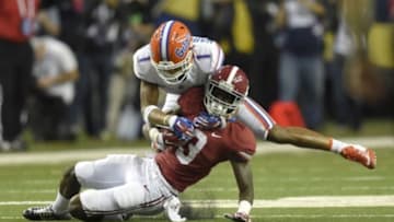 Dec 5, 2015; Atlanta, GA, USA; Alabama Crimson Tide wide receiver Calvin Ridley (3) is brought down by Florida Gators defensive back Vernon Hargreaves III (1) during the second quarter of the 2015 SEC Championship Game at the Georgia Dome. Mandatory Credit: John David Mercer-USA TODAY Sports