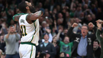 BOSTON - JANUARY 16: Bostons Celtics' Kyrie Irving exults to the crowd as they cheer back after he hit a fourth quarter shot that put Boston ahead 111-106. The Boston Celtics host the Toronto Raptors in a regular season NBA basketball game at TD Garden in Boston on Jan. 16, 2019. (Photo by Jim Davis/The Boston Globe via Getty Images)