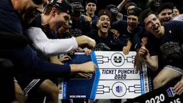 LAS VEGAS, NEVADA - MARCH 07: The Utah State Aggies celebrate after defeating the San Diego State Aztecs to win the championship game of the Mountain West Conference basketball tournament at the Thomas & Mack Center on March 7, 2020 in Las Vegas, Nevada. The Aggies defeated the Aztecs 59-56. (Photo by Joe Buglewicz/Getty Images)