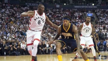 Oct 28, 2015; Toronto, Ontario, CAN; TIndiana Pacers center Jordan Hill (27) drives to the basket as Toronto Raptors forward Bismack Biyombo (8) tries to defend during the third quarter in a game at the Air Canada Centre. The Toronto Raptors won 106-99. Mandatory Credit: Nick Turchiaro-USA TODAY Sports