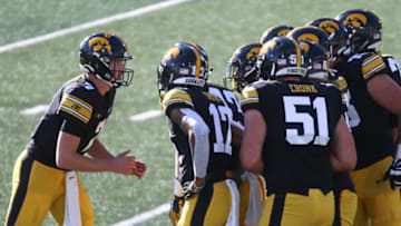 IOWA CITY, IOWA- OCTOBER 31: Quarterback Spencer Petras #7 of the Iowa Hawkeyes calls a play in the huddle during the first half against the Northwestern Wildcats at Kinnick Stadium on October 31, 2020 in Iowa City, Iowa. (Photo by Matthew Holst/Getty Images)
