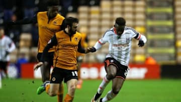 WOLVERHAMPTON, ENGLAND - JANUARY 13: Moussa Dembele of Fulham battles for the ball with Jack Price and Dominic Iorfa of Wolves during the FA Cup third round replay match between Wolverhampton Wanderers and Fulham at Molineux on January 13, 2015 in Wolverhampton, England. (Photo by Jan Kruger/Getty Images)