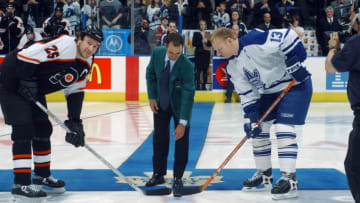TORONTO - APRIL 14: Mike Weir 2003 Masters Champion drops the puck for the ceremonial faceoff between Keith Primeau #25 of the Philadelphia Flyers and Mats Sundin #13 of the Toronto Maple Leafs in the first round of the Stanley Cup playoffs at Air Canada Centre on April 14, 2003 in Toronto, Ontario. The Maple Leafs defeated the Flyers 4-3. (Photo By Dave Sandford/Getty Images/NHLI)
