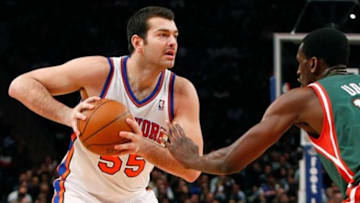 Mar. 26, 2012; New York, NY, USA; New York Knicks forward Josh Harrellson (55) controls the ball as Milwaukee Bucks power forward Ekpe Udoh (13) defends during the second half at Madison Square Garden. Knicks won 89-80. Mandatory Credit: Debby Wong-USA TODAY Sports