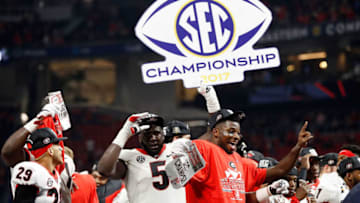 ATLANTA, GA - DECEMBER 02: Julian Rochester #5 of the Georgia Bulldogs and Lorenzo Carter #7 celebrate beating the Auburn Tigers in the SEC Championship at Mercedes-Benz Stadium on December 2, 2017 in Atlanta, Georgia. (Photo by Jamie Squire/Getty Images)