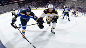 ST. LOUIS, MO - MARCH 21: Ivan Barbashev #49 of the St. Louis Blues and Riley Nash #20 of the Boston Bruins battle for the puck at Scottrade Center on March 21, 2018 in St. Louis, Missouri. (Photo by Scott Rovak/NHLI via Getty Images)