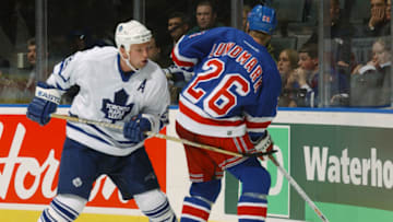 TORONTO - OCTOBER 26: Defenseman Bryan McCabe #24 of the Toronto Maple Leafs prepares to check center Jamie Lundmark #26 of the New York Rangers during the NHL game on October 26, 2002 at the Air Canada Centre,Toronto, Canada. The Rangers won 4-3. (Photo by Dave Sandford/Getty Images/NHLI)