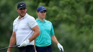 DUBLIN, OHIO - JULY 16: Brooks Koepka of the United States and Rory McIlroy of Northern Ireland look on from the fifth tee during the first round of The Memorial Tournament on July 16, 2020 at Muirfield Village Golf Club in Dublin, Ohio. (Photo by Sam Greenwood/Getty Images)