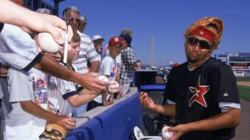 5 Mar 2000: Jose Lima #42 of the Houston Astros signs autographs before the Spring Training Game against the New York Yankees in Tampa Bay, Florida.