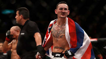 RIO DE JANEIRO, BRAZIL - JUNE 03: Max Holloway celebrates after his TKO victory over Jose Aldo of Brazil in their UFC featherweight championship bout during the UFC 212 event at Jeunesse Arena on June 3, 2017 in Rio de Janeiro, Brazil. (Photo by Buda Mendes/Zuffa LLC/Zuffa LLC via Getty Images)