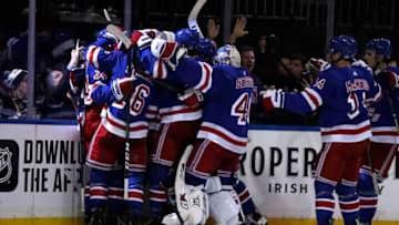Nov 12, 2019; New York, NY, USA; New York Rangers right wing Kaapo Kakko (24) is congratulated by teammates after scoring the game winning goal against the Pittsburgh Penguins during overtime at Madison Square Garden. Mandatory Credit: Adam Hunger-USA TODAY Sports