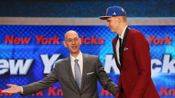 Jun 25, 2015; Brooklyn, NY, USA; Kristaps Porzingis is escorted onto the stage with NBA commissioner Adam Silver after being selected as the number four overall pick to the New York Knicks in the first round of the 2015 NBA Draft at Barclays Center. Mandatory Credit: Brad Penner-USA TODAY Sports