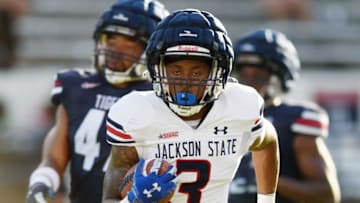 Jackson State's Kevin Coleman Jr. carries after catching a pass from Sheduer Sanders duringn JSU's spring game at Veterans Memorial Stadium in Jackson, Miss., Sunday, April 24, 2022.Tcl Jsu