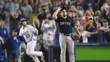 LOS ANGELES, CA - OCTOBER 26: Nathan Eovaldi #17 of the Boston Red Sox watches the ball leave the park as Max Muncy #13 of the Los Angeles Dodgers hits and eighteenth inning walk-off home run to win the game 3-2 in Game Three of the 2018 World Series at Dodger Stadium on October 26, 2018 in Los Angeles, California. (Photo by Kevork Djansezian/Getty Images)