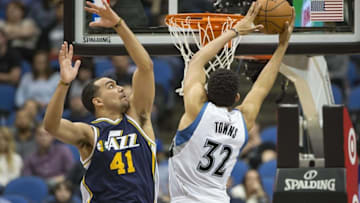 Mar 26, 2016; Minneapolis, MN, USA; Minnesota Timberwolves center Karl-Anthony Towns (32) goes up for a layup past Utah Jazz forward Trey Lyles (41) in the second half at Target Center. the Jazz won 93-84. Mandatory Credit: Jesse Johnson-USA TODAY Sports