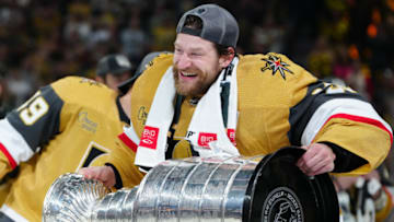 Jun 13, 2023; Las Vegas, Nevada, USA; Vegas Golden Knights goaltender Adin Hill (33) hoists the Stanley Cup after defeating the Florida Panthers in game five of the 2023 Stanley Cup Final at T-Mobile Arena. Mandatory Credit: Stephen R. Sylvanie-USA TODAY Sports