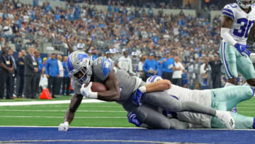 ARLINGTON, TX - SEPTEMBER 30: Detroit Lions running back Kerryon Johnson (33) crosses the goal line for a touchdown with Dallas Cowboys linebacker Leighton Vander Esch (55) defending during the game between the Detroit Lions and Dallas Cowboys on September 30, 2018 at AT&T Stadium in Arlington, TX. (Photo by Andrew Dieb/Icon Sportswire via Getty Images)
