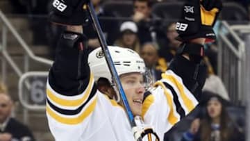 Dec 14, 2016; Pittsburgh, PA, USA; Boston Bruins right wing David Pastrnak (88) reacts after scoring a goal against the Pittsburgh Penguins during the third period at the PPG PAINTS Arena. The Penguins won 4-3 in overtime. Mandatory Credit: Charles LeClaire-USA TODAY Sports