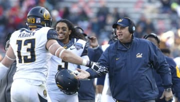 Dec 29, 2015; Fort Worth, TX, USA; California Golden Bears head coach Sonny Dykes congratulates defensive end Kyle Kragen (13) after a fumble recovery in the game against the Air Force Falcons at Amon G. Carter Stadium. California won 55-36. Mandatory Credit: Tim Heitman-USA TODAY Sports