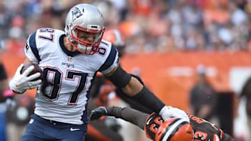 Oct 9, 2016; Cleveland, OH, USA; New England Patriots tight end Rob Gronkowski (87) runs with the ball as Cleveland Browns free safety Jordan Poyer (33) defends during the first quarter at FirstEnergy Stadium. Mandatory Credit: Ken Blaze-USA TODAY Sports