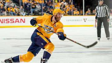 NASHVILLE, TN - DECEMBER 27: Mattias Ekholm #14 of the Nashville Predators shoots the puck against the Dallas Stars at Bridgestone Arena on December 27, 2018 in Nashville, Tennessee. (Photo by John Russell/NHLI via Getty Images)