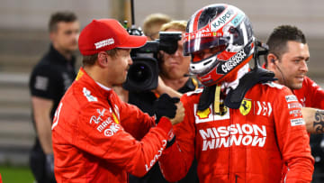 BAHRAIN, BAHRAIN - MARCH 30: Pole position qualifier Charles Leclerc of Monaco and Ferrari is congratulated by second placed qualifier Sebastian Vettel of Germany and Ferrari in parc ferme during qualifying for the F1 Grand Prix of Bahrain at Bahrain International Circuit on March 30, 2019 in Bahrain, Bahrain. (Photo by Mark Thompson/Getty Images)