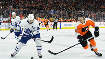 Mar 27, 2019; Philadelphia, PA, USA; Toronto Maple Leafs center John Tavares (91) and Philadelphia Flyers defenseman Philippe Myers (61) battle for the puck during the first period at Wells Fargo Center. Mandatory Credit: Eric Hartline-USA TODAY Sports