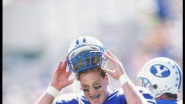 22 Sep 1990: Chris Smith of the Brigham Young Cougars takes off his helmet during a game against the San Diego State Aztecs at Cougar Stadium in Provo, Utah. Brigham Young won the game 62-34. Mandatory Credit: Mike Powell /Allsport