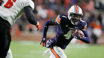Auburn footballNov 19, 2022; Auburn, Alabama, USA; Auburn Tigers cornerback D.J. James (4) returns an interception for a touchdown during the fourth quarter against the Western Kentucky Hilltoppers at Jordan-Hare Stadium. Mandatory Credit: John Reed-USA TODAY Sports