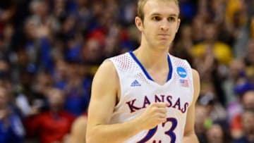 Mar 23, 2014; St. Louis, MO, USA; Kansas Jayhawks guard Conner Frankamp (23) celebrates after hitting a three-point shot at the end of the first half against the Stanford Cardinal in the third round of the 2014 NCAA Men's Basketball Championship at Scottrade Center. Mandatory Credit: Jasen Vinlove-USA TODAY Sports