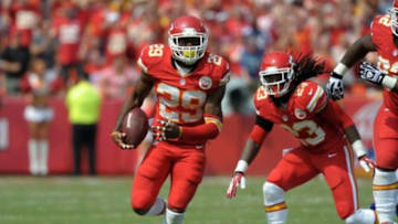 Sep 15, 2013; Kansas City, MO, USA; Kansas City Chiefs strong safety Eric Berry (29) runs for yardage after recovering a fumble from Dallas Cowboys running back Lance Dunbar (25) (not pictured) during the second half at Arrowhead Stadium. The Chiefs won 17-16. Mandatory Credit: Denny Medley-USA TODAY Sports