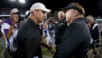 FORT WORTH, TX - OCTOBER 21: Head coach David Beaty of the Kansas Jayhawks talks with head coach Gary Patterson of the TCU Horned Frogs at midfield after TCU beat Kansas 43-0 at Amon G. Carter Stadium on October 21, 2017 in Fort Worth, Texas. (Photo by Tom Pennington/Getty Images)