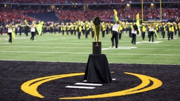 ARLINGTON, TX - JANUARY 12: National Championship Trophy sits in the end zone prior to the College Football Playoff National Championship Game between the Oregon Ducks and the Ohio State Buckeyes at AT&T Stadium on January 12, 2015 in Arlington, Texas. (Photo by Ronald Martinez/Getty Images)