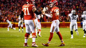 KANSAS CITY, MO - DECEMBER 30: Patrick Mahomes #15 of the Kansas City Chiefs is congratulated by teammate Mitchell Schwartz #71 after throwing his fiftieth touchdown of the season during the third quarter of the game against the Oakland Raiders at Arrowhead Stadium on December 30, 2018 in Kansas City, Missouri. (Photo by Jason Hanna/Getty Images)