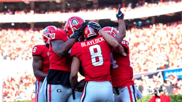 ATHENS, GA - OCTOBER 15: Dominick Blaylock #8 of the Georgia Bulldogs celebrates with teammates after scoring a touchdown against the Vanderbilt Commodores during the second quarter at Sanford Stadium on October 15, 2022 in Athens, Georgia. (Photo by Adam Hagy/Getty Images)