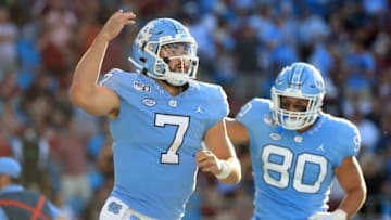 CHARLOTTE, NORTH CAROLINA - AUGUST 31: Sam Howell #7 of the North Carolina Tar Heels reacts after a score against the South Carolina Gamecocks during the Belk College Kickoff game at Bank of America Stadium on August 31, 2019 in Charlotte, North Carolina. (Photo by Streeter Lecka/Getty Images)