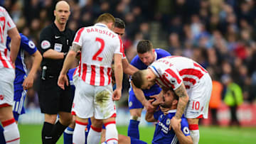 STOKE ON TRENT, ENGLAND - MARCH 18: Marko Arnautovic of Stoke City helps Diego Costa of Chelsea off the ground during the Premier League match between Stoke City and Chelsea at Bet365 Stadium on March 18, 2017 in Stoke on Trent, England. (Photo by Tony Marshall/Getty Images)