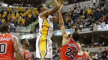 Oct 6, 2016; Indianapolis, IN, USA; Indiana Pacers guard Glenn Robinson III (40) shoots the ball over Chicago Bulls guard Spencer Dinwiddie (25) at Bankers Life Fieldhouse. Mandatory Credit: Brian Spurlock-USA TODAY Sports