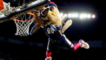 Mar 24, 2014; New Orleans, LA, USA; New Orleans Pelicans mascot Pierre the Pelicans performs a dunk during a break in the action in the second quarter of a game against the Brooklyn Nets at the Smoothie King Center. Mandatory Credit: Derick E. Hingle-USA TODAY Sports