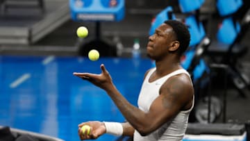 Illinois Fighting Illini center Kofi Cockburn (21) juggles tennis balls during warmups ahead of tipoff against Loyola Chicago during the second round of the 2021 NCAA Tournament on Sunday, March 21, 2021, at Bankers Life Fieldhouse in Indianapolis, Ind. Mandatory Credit: Alton Strupp/IndyStar via USA TODAY Sports