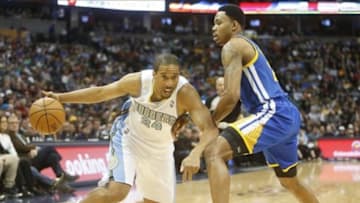 Dec 23, 2013; Denver, CO, USA; Denver Nuggets guard Andre Miller (24) drives to the basket past Golden State Warriors guard Kent Bazemore (20) during the first half at Pepsi Center. Mandatory Credit: Chris Humphreys-USA TODAY Sports