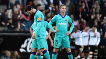 Barcelona's Argentine forward Lionel Messi and Barcelona's Dutch midfielder Frenkie De Jong react during the Spanish league football match Valencia CF against FC Barcelona at the Mestalla stadium in Valencia on January 25, 2020. (Photo by JOSE JORDAN / AFP) (Photo by JOSE JORDAN/AFP via Getty Images)
