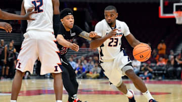CHICAGO, IL - DECEMBER 16: Illinois Fighting Illini guard Aaron Jordan (23) dribbles to the basket after Illinois Fighting Illini forward Leron Black (12) sets a pick on New Mexico State Aggies guard Zach Lofton (23) during the game between the Illinois Fighting Illini and the New Mexico State Aggies on December 16, 2017 at the United Center in Chicago, Illinois. (Photo by Quinn Harris/Icon Sportswire via Getty Images)
