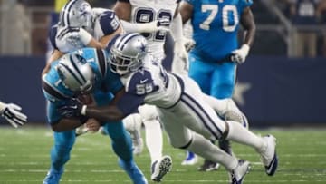 Nov 26, 2015; Arlington, TX, USA; Dallas Cowboys middle linebacker Rolando McClain (55) tackles Carolina Panthers quarterback Cam Newton (1) during the second quarter of an NFL game on Thanksgiving at AT&T Stadium. Mandatory Credit: Jerome Miron-USA TODAY Sports