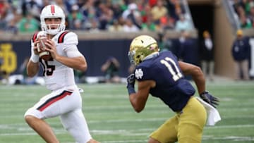 SOUTH BEND, IN - SEPTEMBER 08: Riley Neal #15 of the Ball State Cardinals is chased by Alohi Gilman #11 of the Notre Dame Fighting Irish at Notre Dame Stadium on September 8, 2018 in South Bend, Indiana. (Photo by Jonathan Daniel/Getty Images)