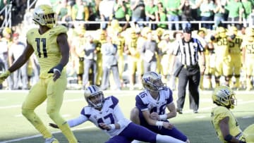 GENE, OR - OCTOBER 13: Linebacker Justin Hollins #11 of the Oregon Ducks, place kicker Peyton Henry #47 of the Washington Huskies, punter/holder Race Porter #46 of the Washington Huskies and cornerback Thomas Graham Jr. #4 of the Oregon Ducks watch as Henry's field goal attempt to win the game misses in the final seconds of the regulation at Autzen Stadium on October 13, 2018 in Eugene, Oregon. The Ducks won the game in overtime 30-27. (Photo by Steve Dykes/Getty Images)