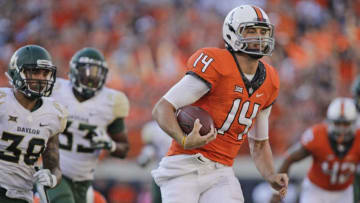 STILLWATER, OK - OCTOBER 14: Quarterback Taylor Cornelius #14 of the Oklahoma State Cowboys breaks away on a touchdown run against the Baylor Bears at Boone Pickens Stadium on October 14, 2017 in Stillwater, Oklahoma. Oklahoma State defeated Baylor 59-16. (Photo by Brett Deering/Getty Images)
