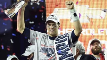 Feb 1, 2015; Glendale, AZ, USA; New England Patriots quarterback Tom Brady (12) hoists the Vince Lombardi Trophy after defeating the Seattle Seahawks in Super Bowl XLIX at University of Phoenix Stadium. Mandatory Credit: Kyle Terada-USA TODAY Sports