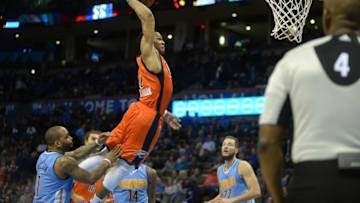 Dec 27, 2015; Oklahoma City, OK, USA; Oklahoma City Thunder guard Russell Westbrook (0) dunks the ball against the Denver Nuggets during the fourth quarter at Chesapeake Energy Arena. Mandatory Credit: Mark D. Smith-USA TODAY Sports